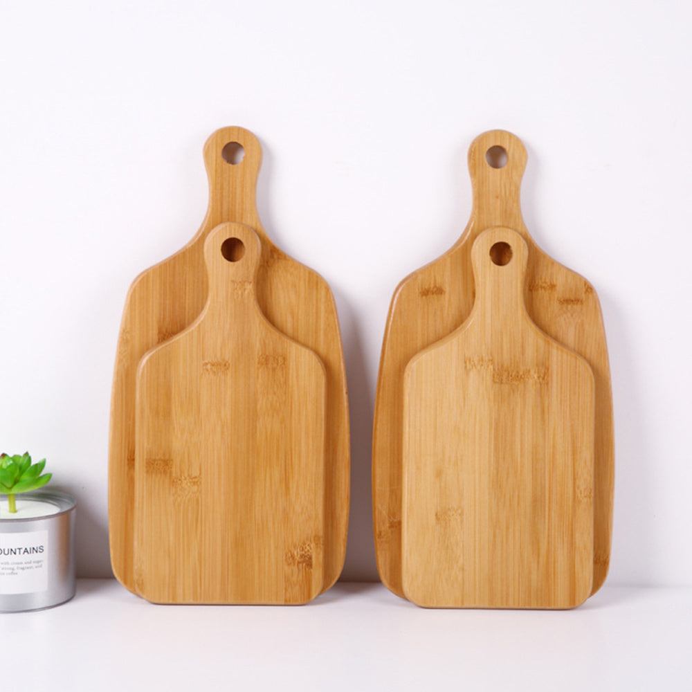 Modern minimalist wooden cutting boards with home handle for hanging, made from beech.