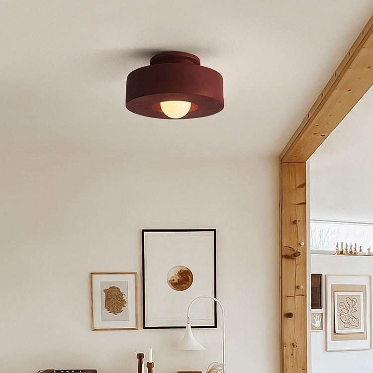 Nordic minimalist ceiling mounted lighting fixture in living room setting.