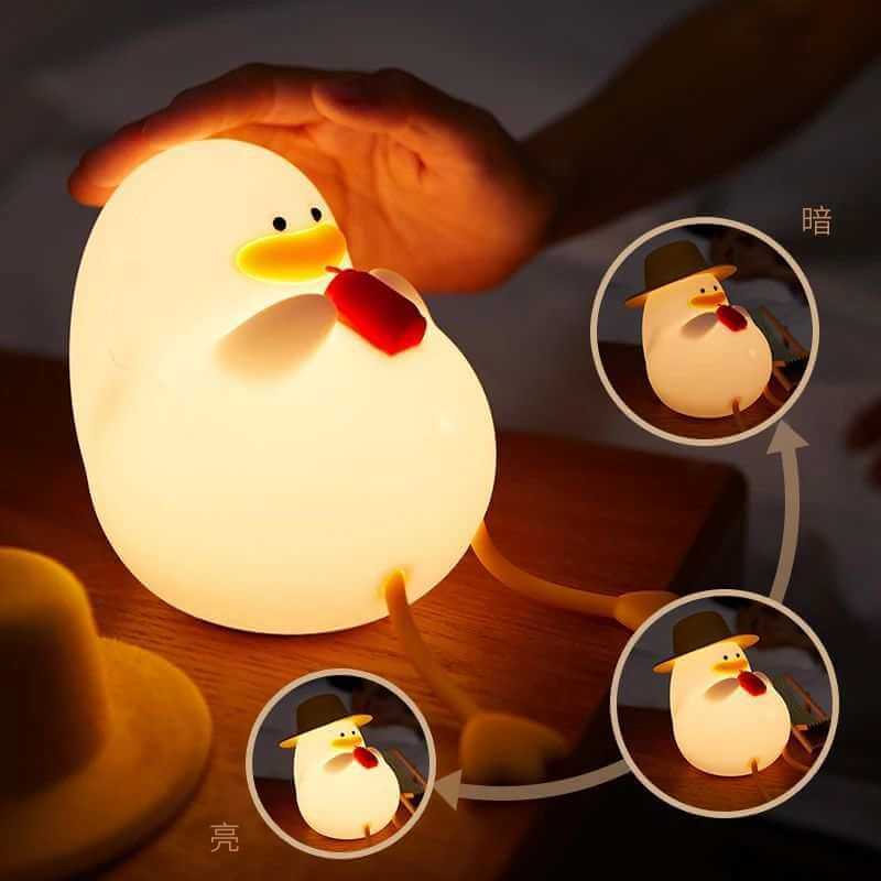 Duck-shaped night lamp with soft silicone exterior, featuring various lighting modes, ideal for bedroom decor.  