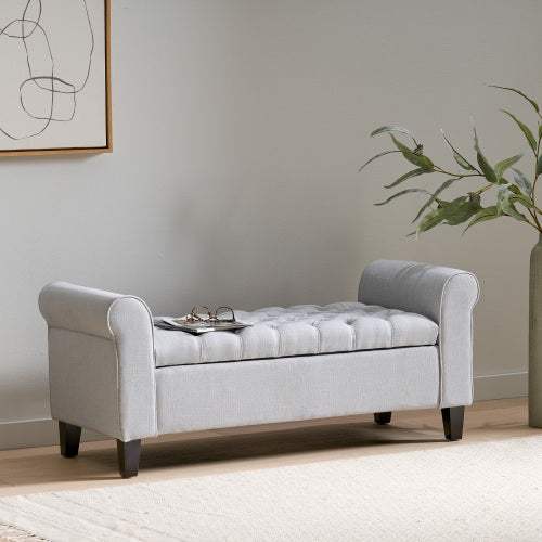 Light grey Hayes armed storage bench with tufted design, rolled arms, and wooden legs, offering contemporary style and versatile functionality.