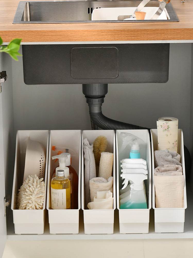 Kitchen cabinet organizer storage box under sink with cleaning supplies.