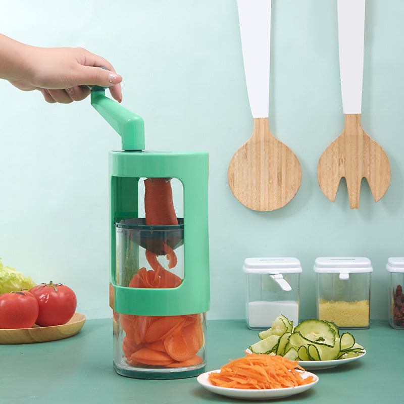 Multifunctional vegetable cutter slicing carrots in kitchen setting.