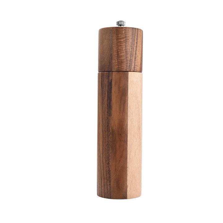 Cylindrical ceramic core acacia wood pepper grinder with metal top.