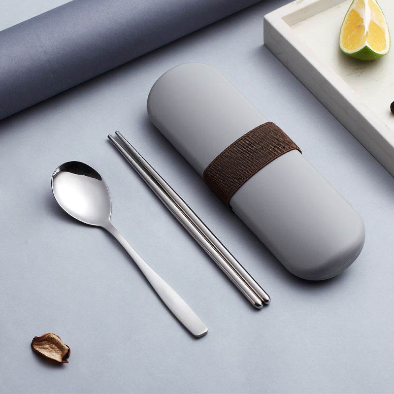 Stainless steel portable cutlery set with spoon and chopsticks in a carry case.