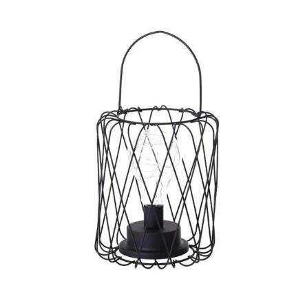Minimalist hollow table lamp with iron frame and central bulb, ideal for elegant home decor.