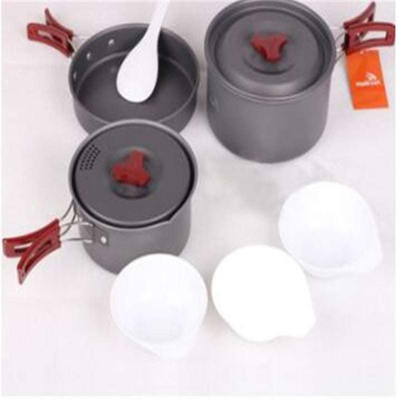 Picnic cookware set with various pots and utensils, made of hard alumina, ideal for camping.