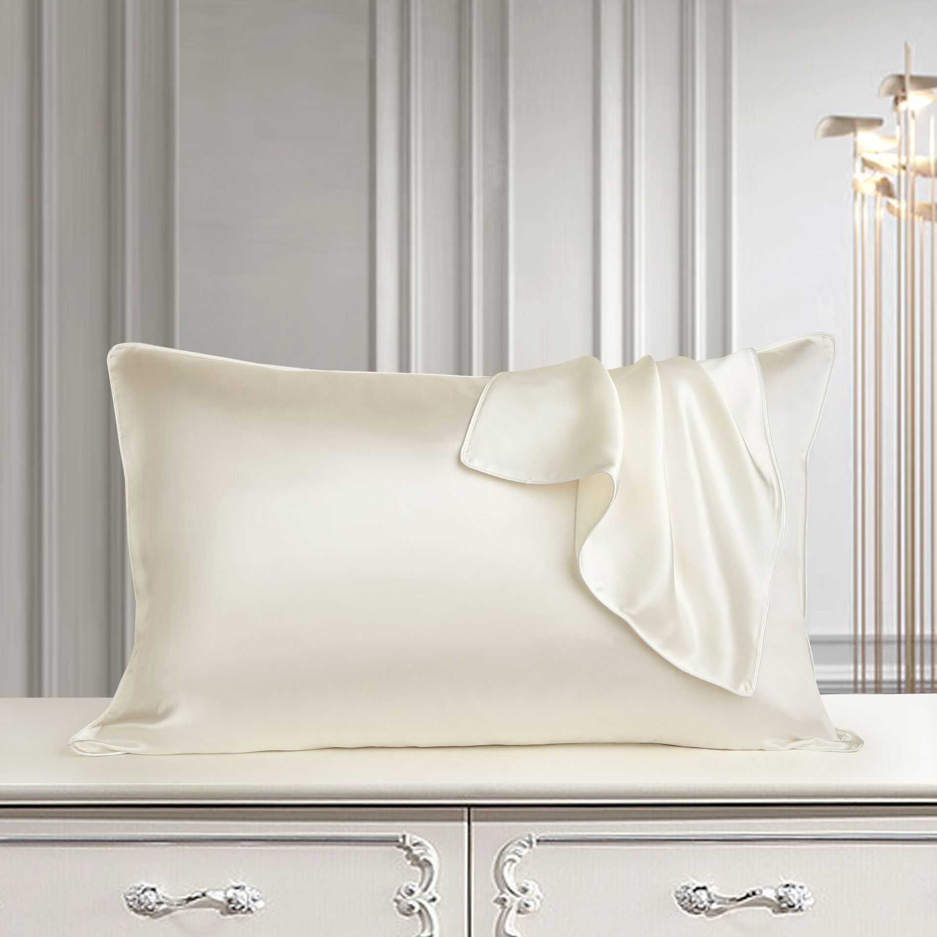 Palace luxury style mulberry silk pillowcase on elegant dresser.