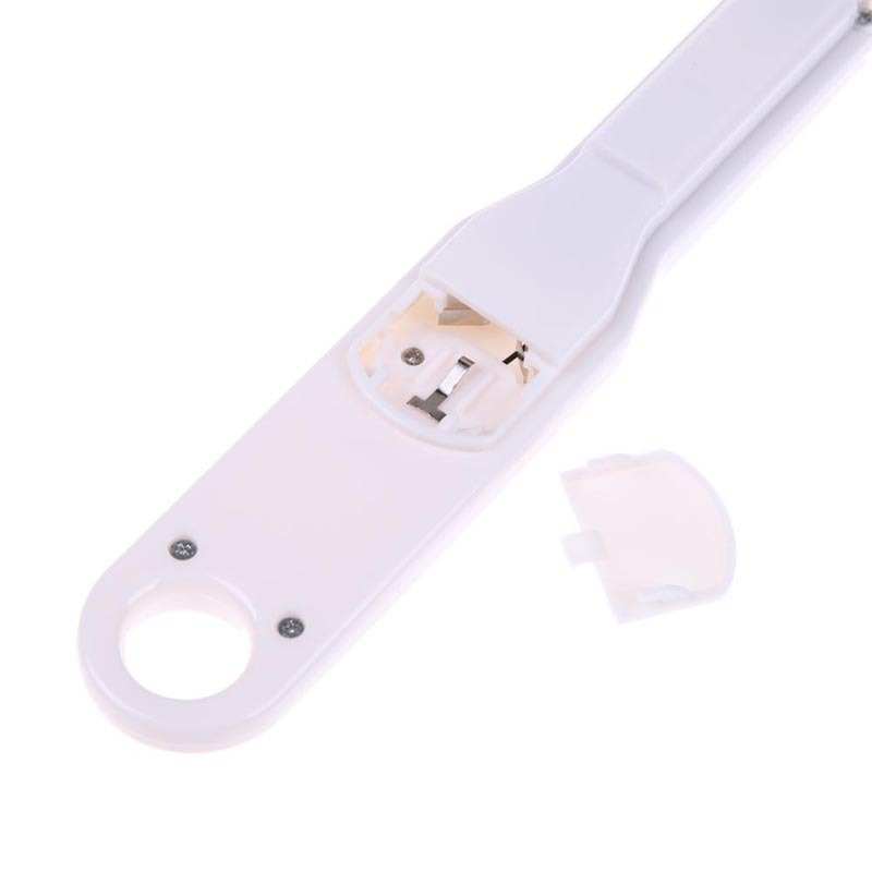 White LCD digital kitchen scale spoon with battery compartment, ideal for precise food measurement.