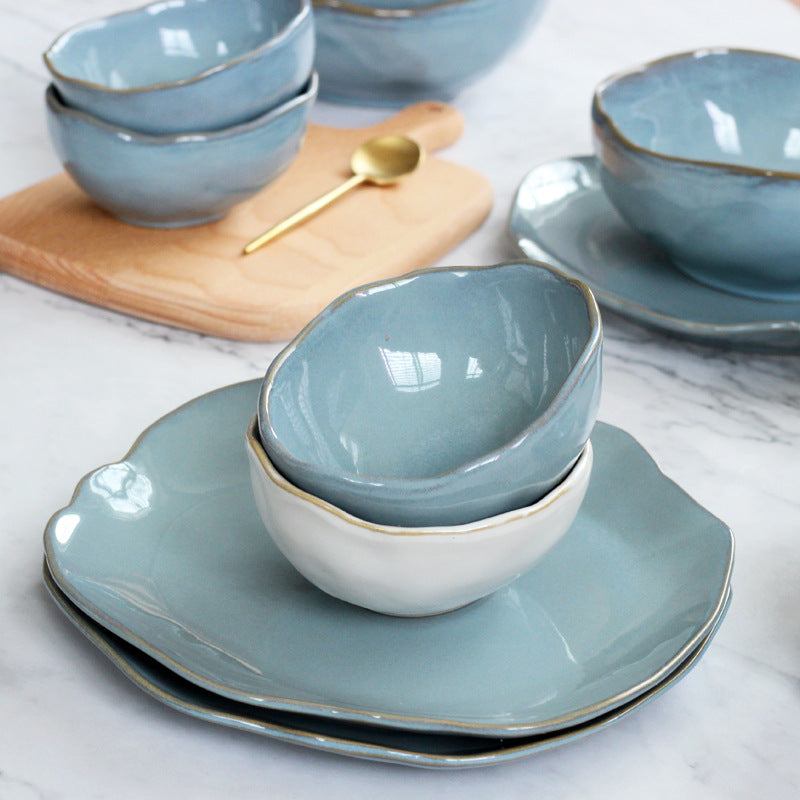 Nordic creative irregular ceramic tableware set with handmade blue kiln glaze design, featuring unique shapes and dynamic color variations.