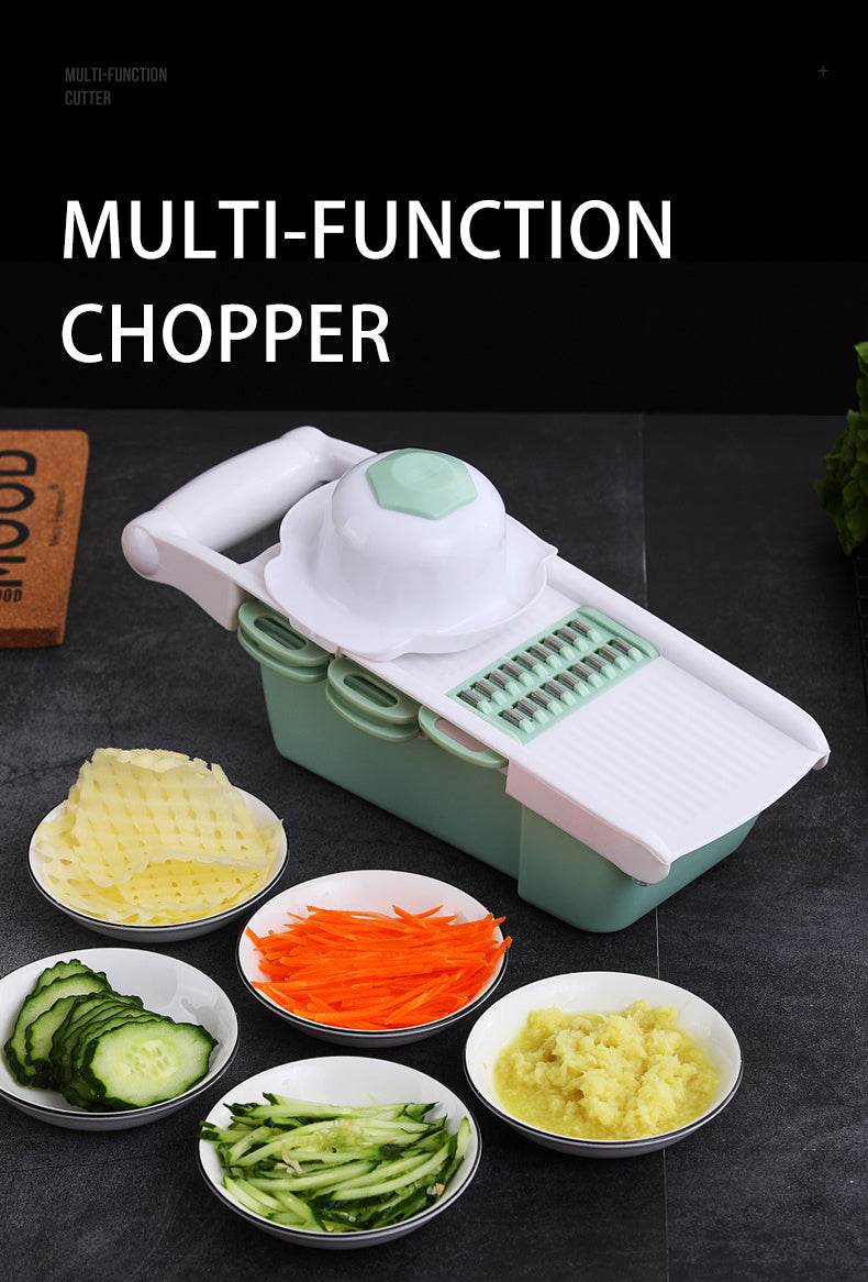 Multifunction kitchen utensil with grater, slicer, and chopper features in green and pink for vegetables.
