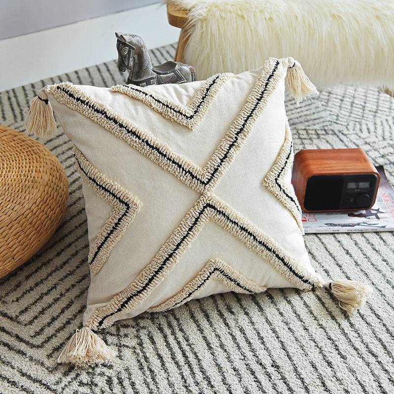 Modern minimalist Nordic style cotton pillowcase with geometric design in a cozy indoor setting.
