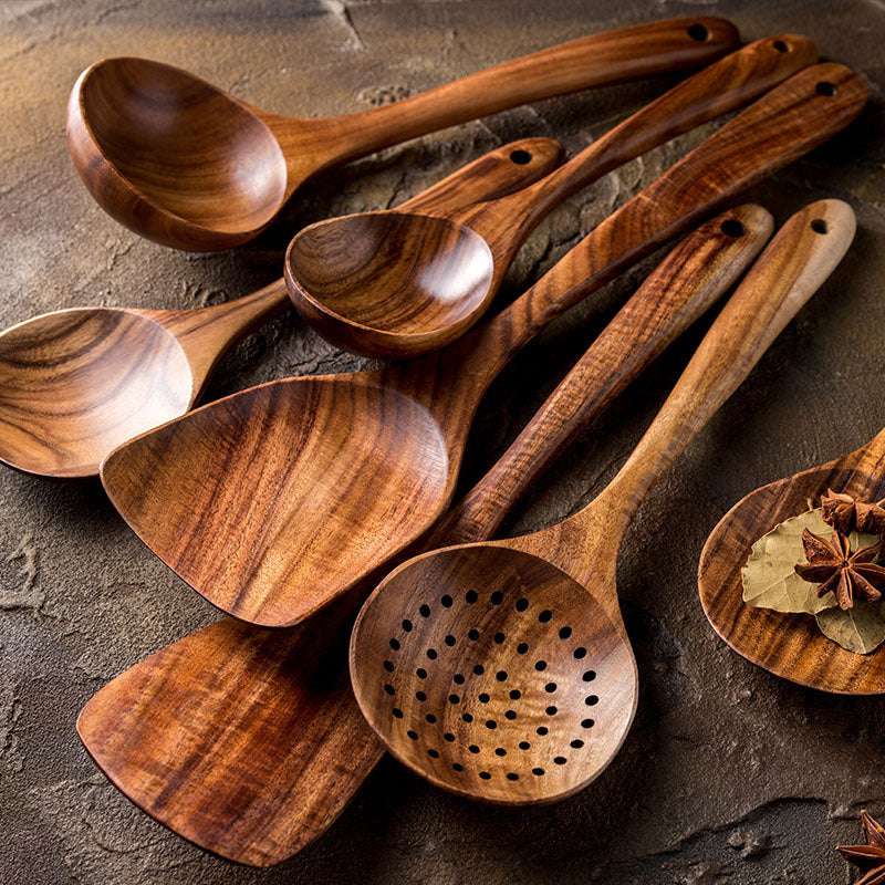 Thailand teak natural wood tableware set with spoons, ladles, and skimmers, showcasing elegant design and craftsmanship.