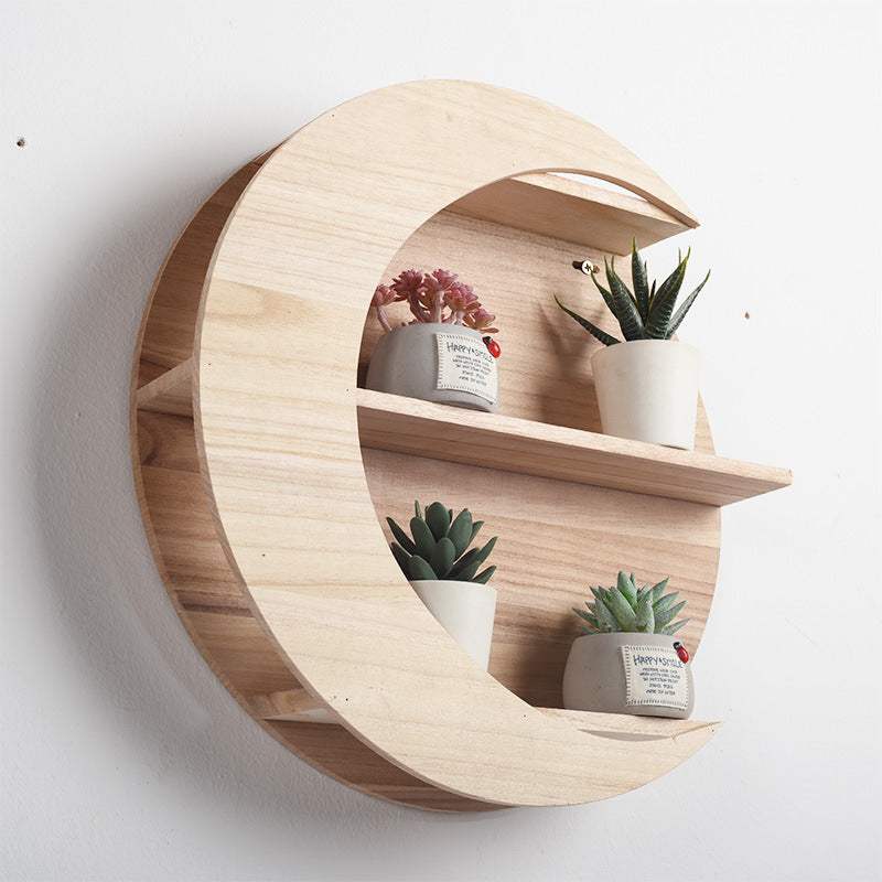 Nordic minimalist wall shelf with abstract design in paulownia wood.