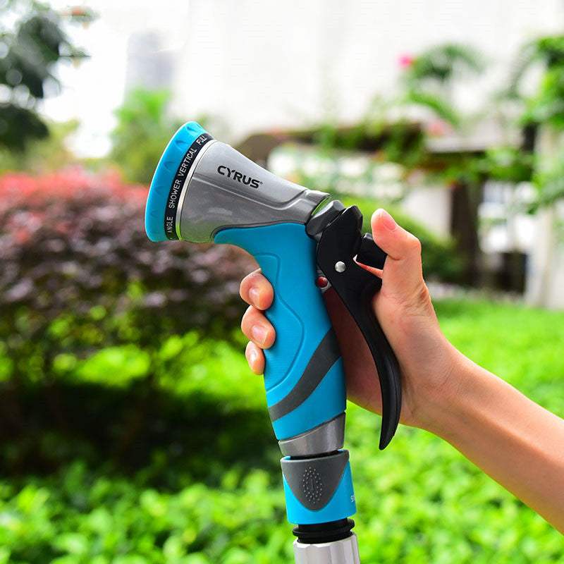 Garden sprayer water spray bottle with ergonomic handle in use.
