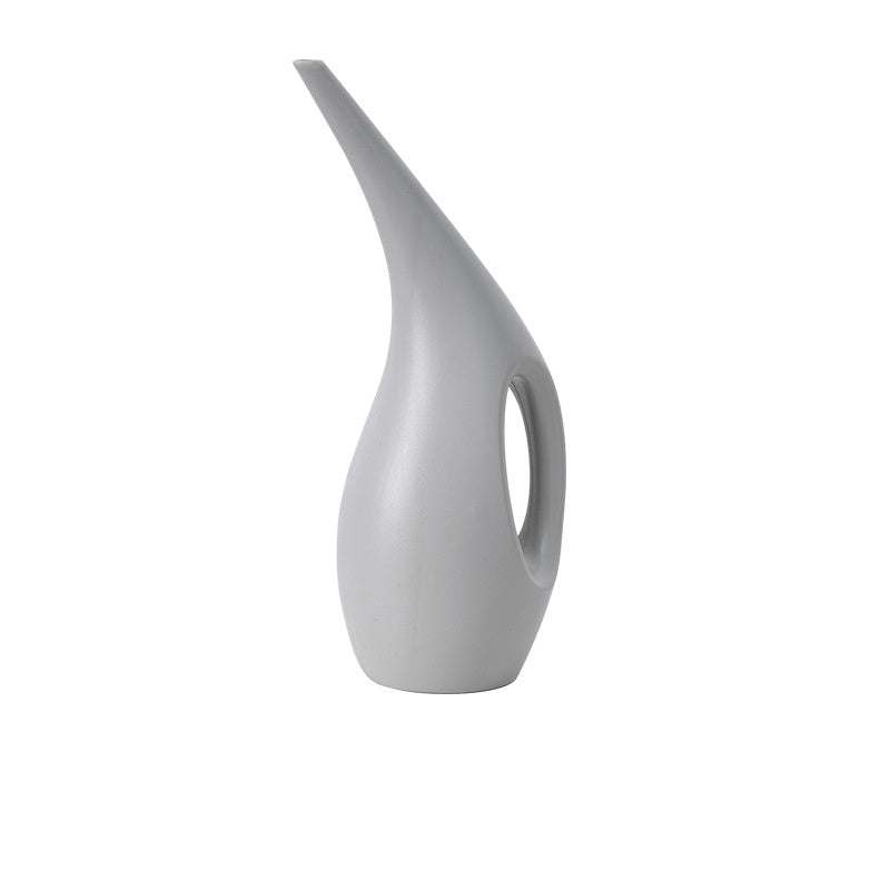 Light gray plastic watering can for indoor and outdoor plants.