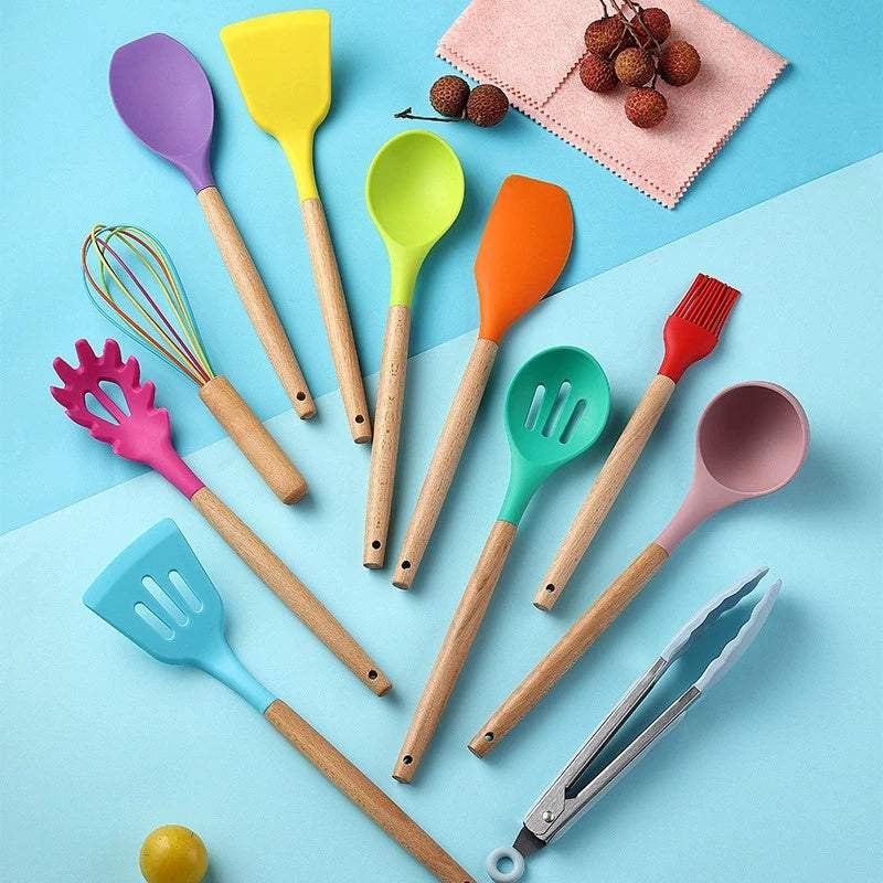 Silicone kitchenware set with wooden handles on colorful background.