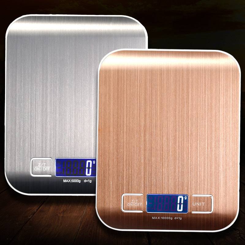 Rechargeable flat stainless steel kitchen scale with digital display in silver and gold color.