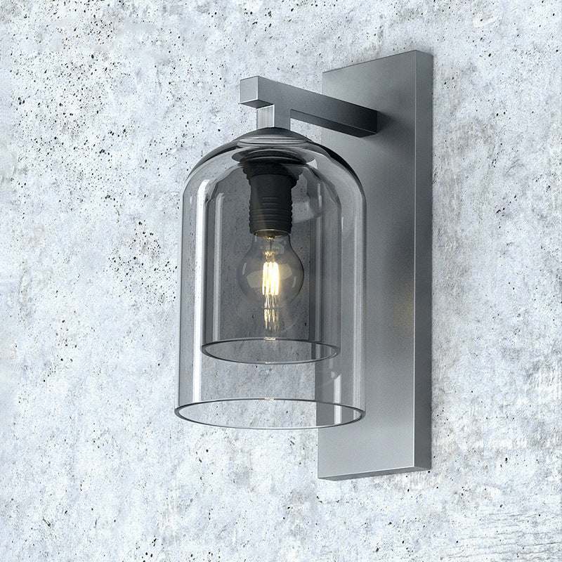 Nordic wall lamp with glass shade in modern design, suitable for home spaces.
