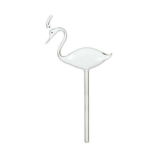 Glass automatic watering device for potted green plants shaped like a bird.