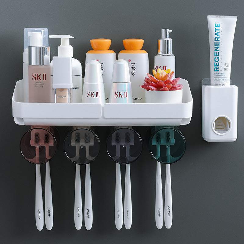 Wall-mounted toothbrush holder with suction cups and multiple compartments for storage.