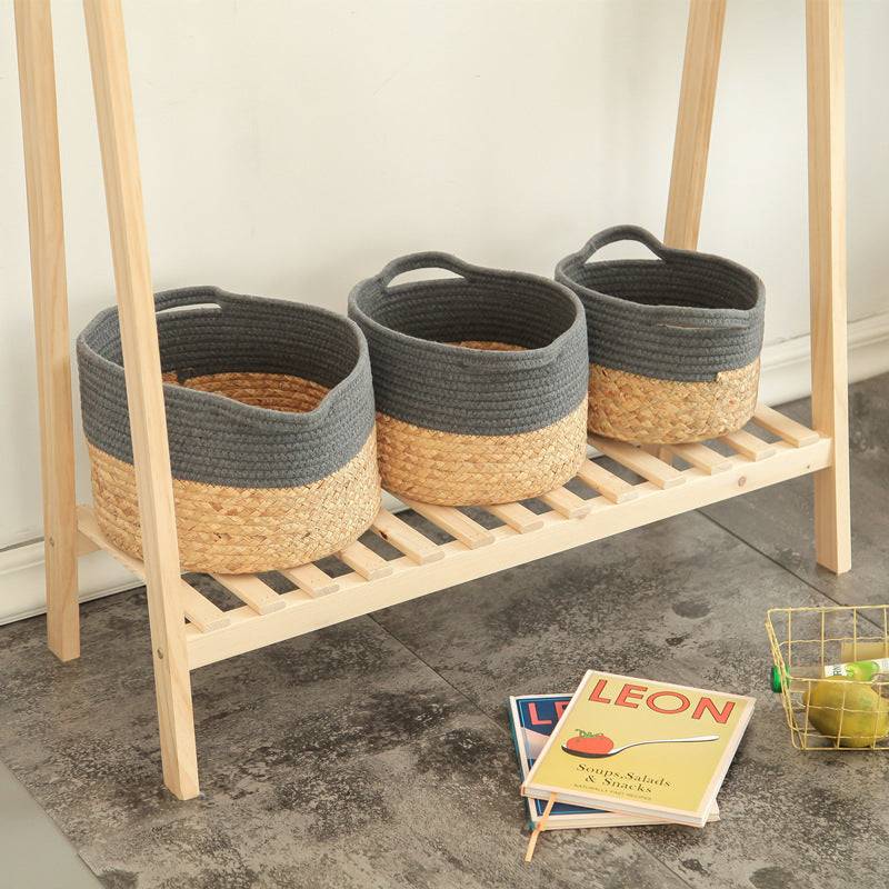 Nordic household folding storage baskets in white and gray on a wooden shelf.