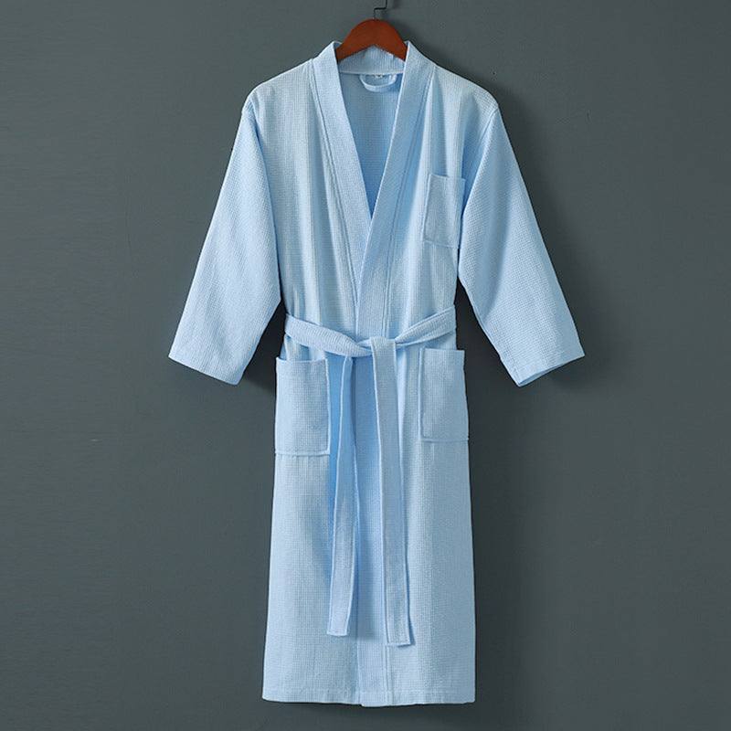 Five star hotel bathrobe for men and women in light blue cotton with belt and pockets.