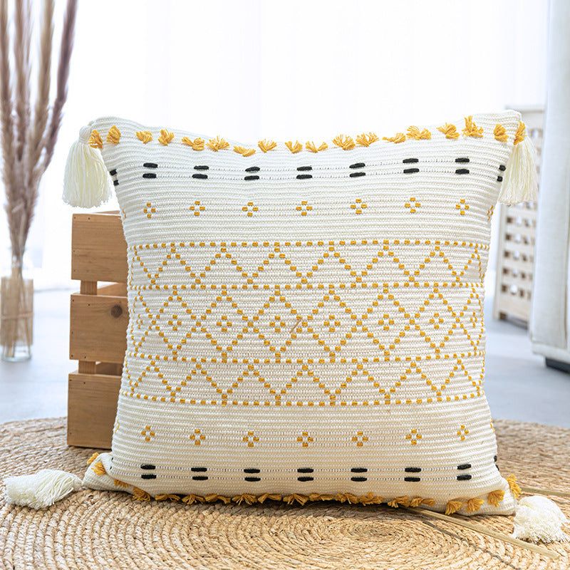 Nordic resort style geometric abstraction pillow with tassels, polyester cotton blend.