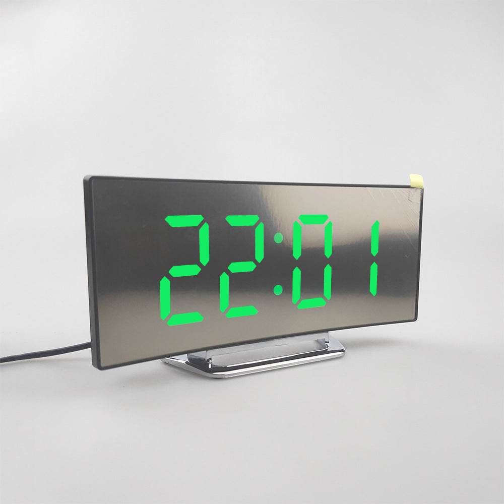 LED alarm clock with dual USB outputs and digital display on a sleek mirror panel.
