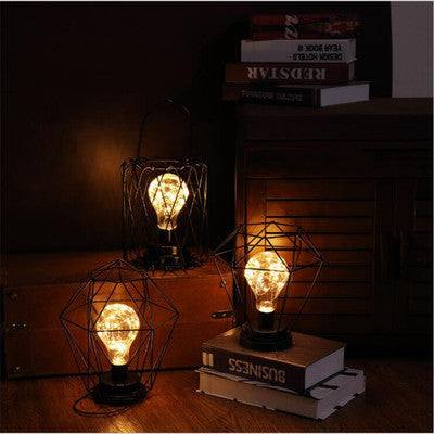 Minimalist hollow table lamps with creative iron design and soft warm lighting for home decor.