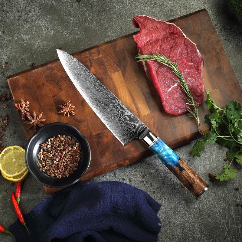 Stainless steel kitchen slicing knife with a modern design on a wooden cutting board.