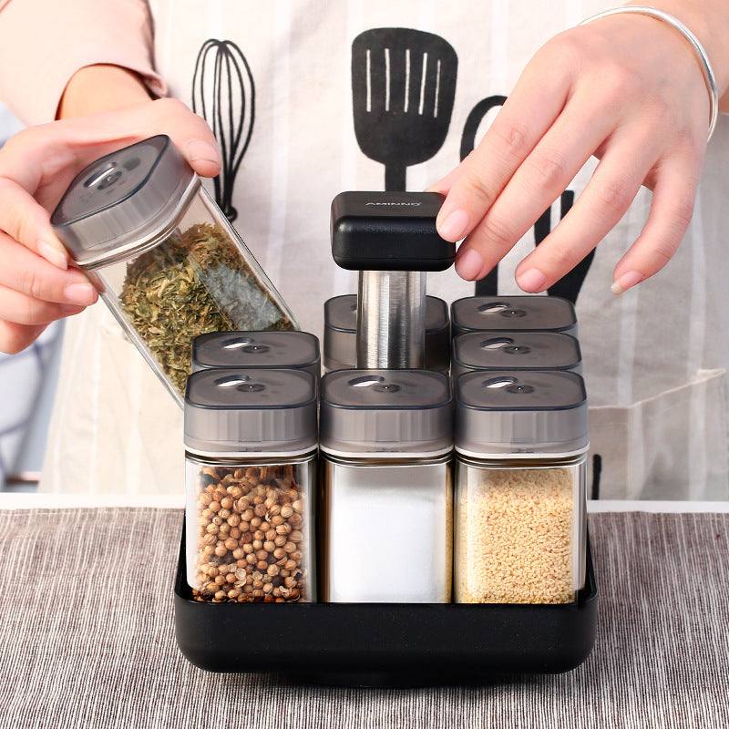 Spice jar glass organizer with covered style for kitchen storage.