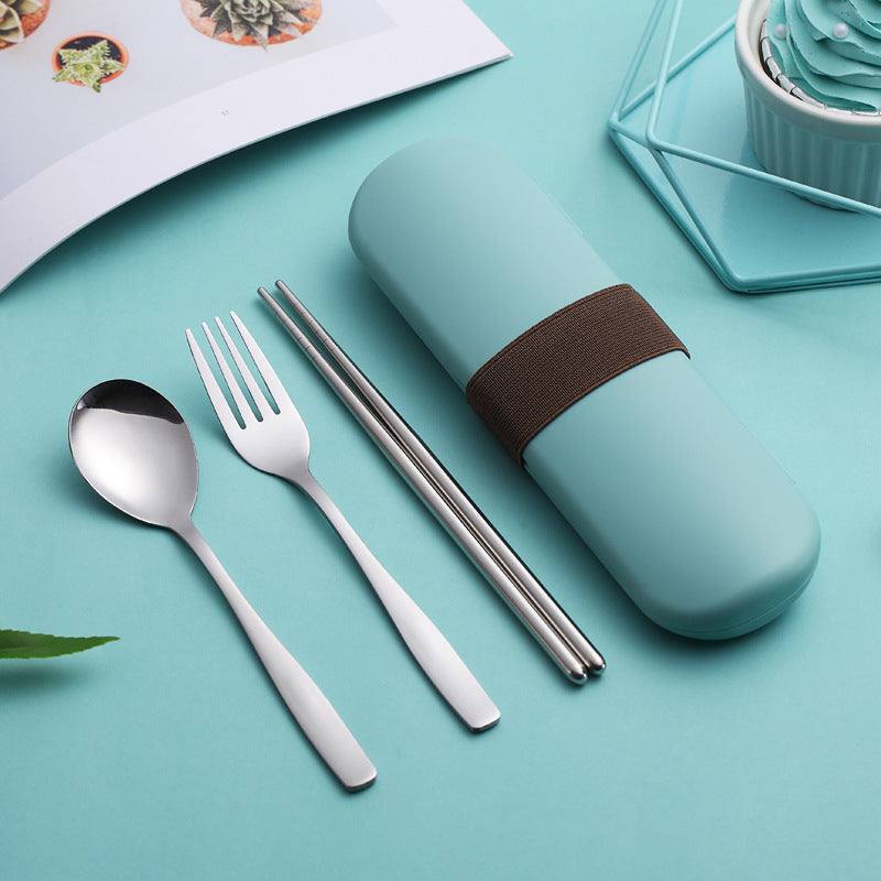 Stainless steel portable cutlery set with case on a blue surface.