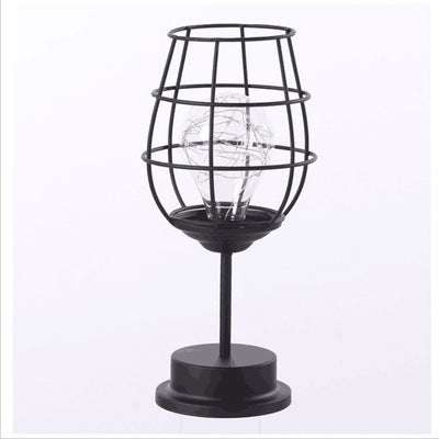 Minimalist hollow table lamp with iron design, perfect for home decoration and soft lighting.