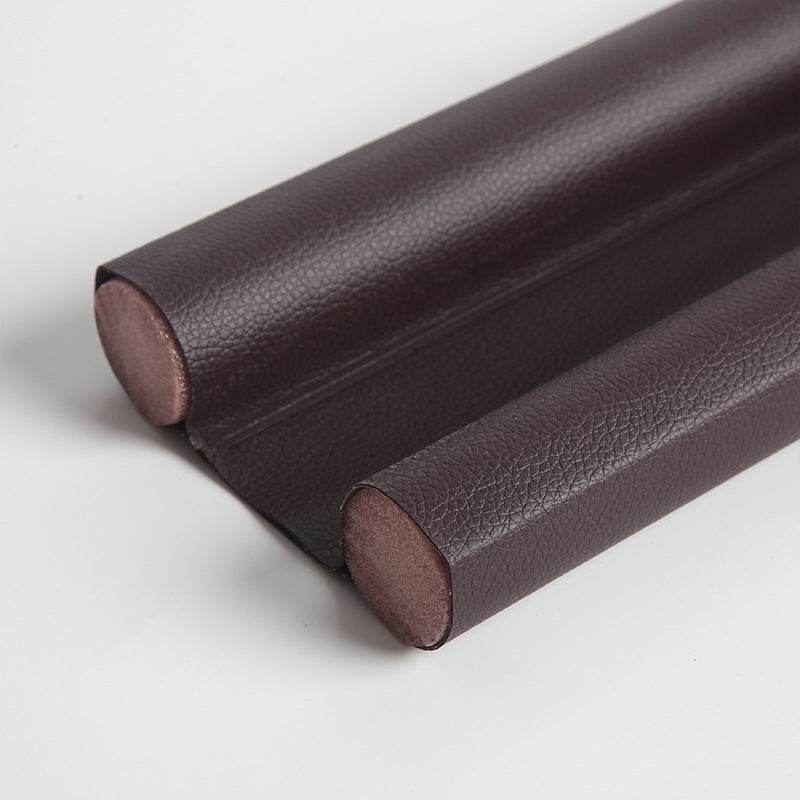 Sealing strip for door bottom, providing wear and corrosion resistance. 