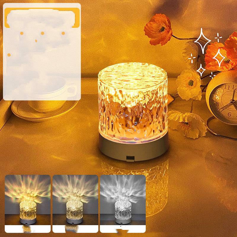Water ripple rotating night light with acrylic shade, USB power, and remote control; features tricolor projection creating ambiance. 