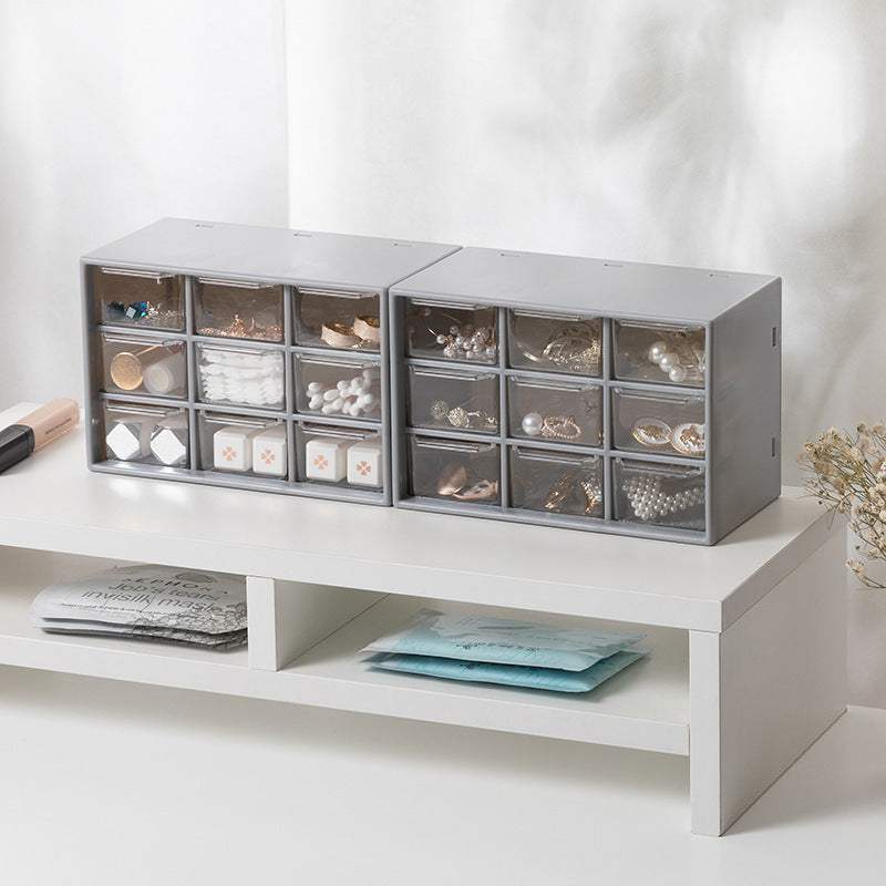 Transparent desktop storage box with compartments for organizing items like stationery, cosmetics, and sundries.