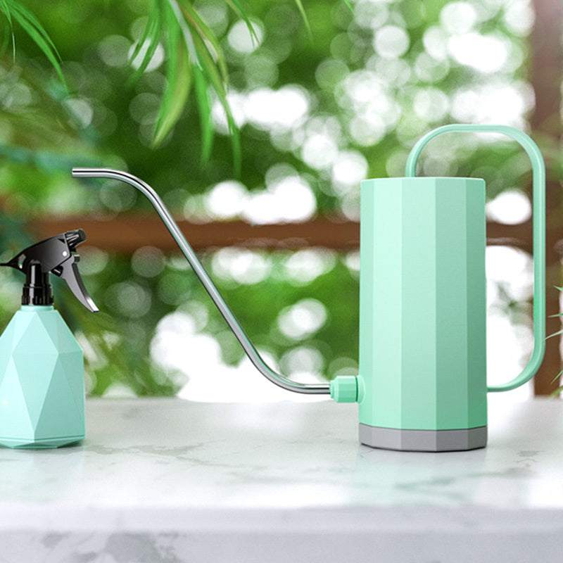 Plant watering can with long stainless steel spout, 1200ML capacity for garden use.