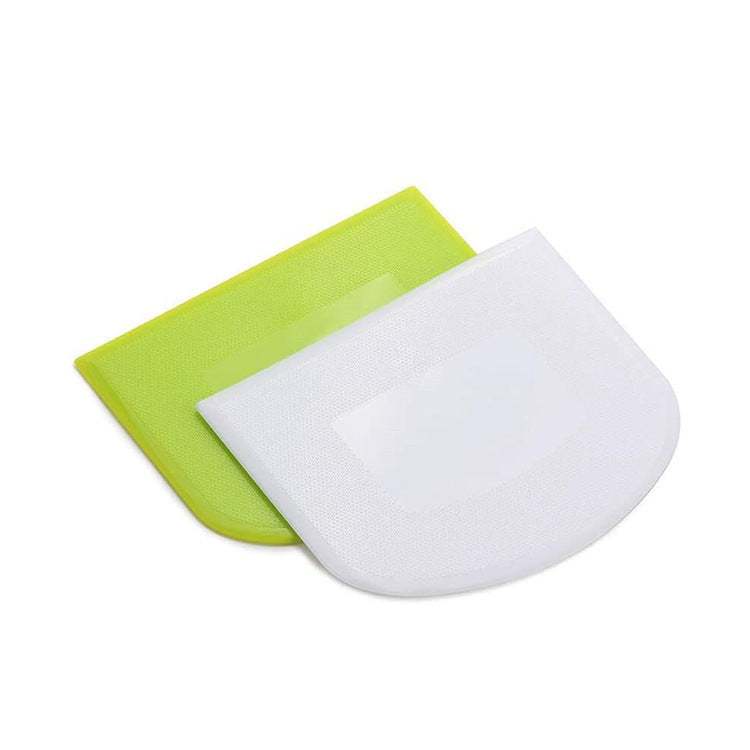 Plastic kitchen flour cutting scrapers in green and white.