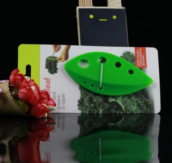 Leaf-shaped herb stripper tool for kitchen use.
