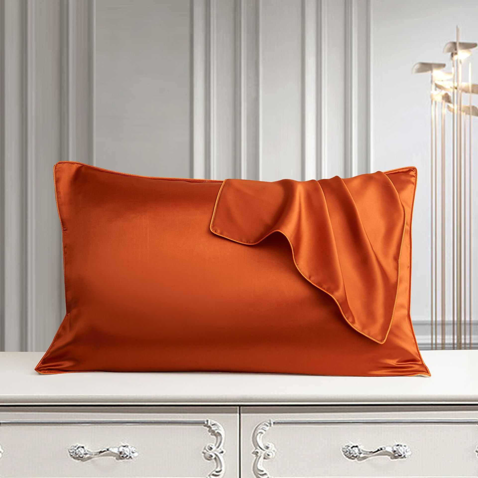 Luxury silk pillowcase in palace style, crafted from mulberry silk, displayed on a white dresser.