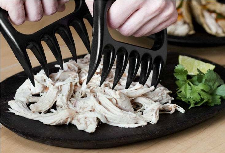 Creative Bear Claw Shredder in action shredding chicken on a plate for barbecue BBQ.