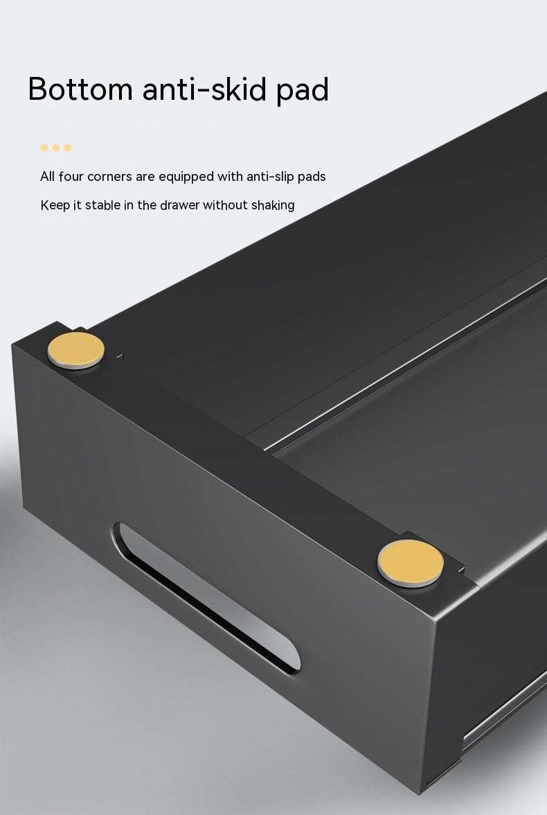 Kitchen drawer storage box with anti-skid pads for stability.