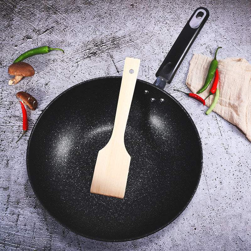 Three-piece cookware set with a non-stick pan and wooden spatula, suitable for gas stoves.