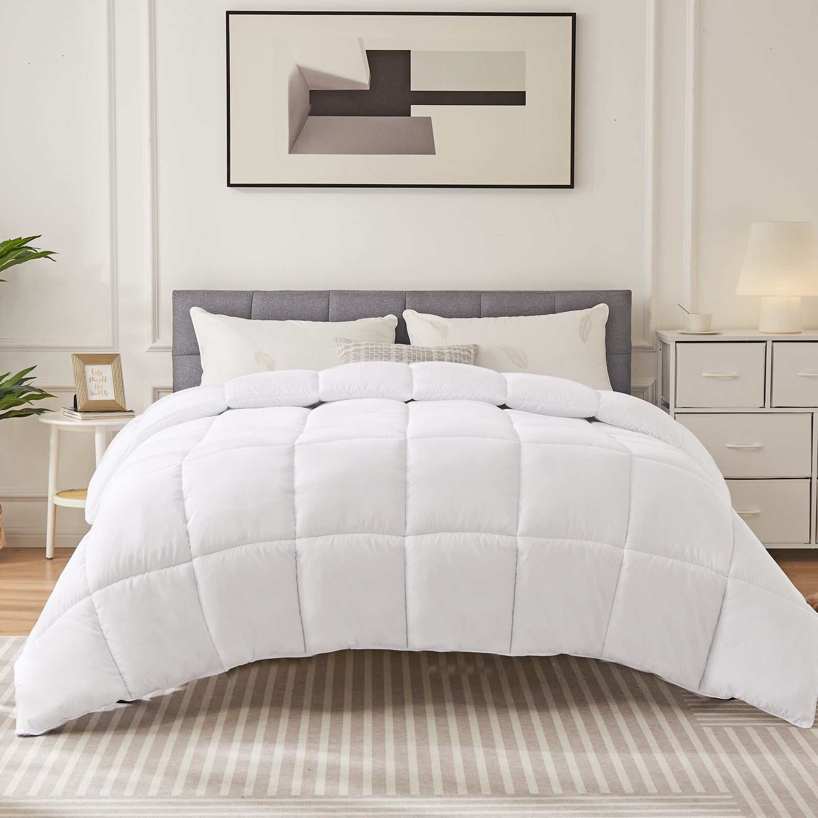 Four Season Universal Down Comforter on a bed in a modern bedroom setting.