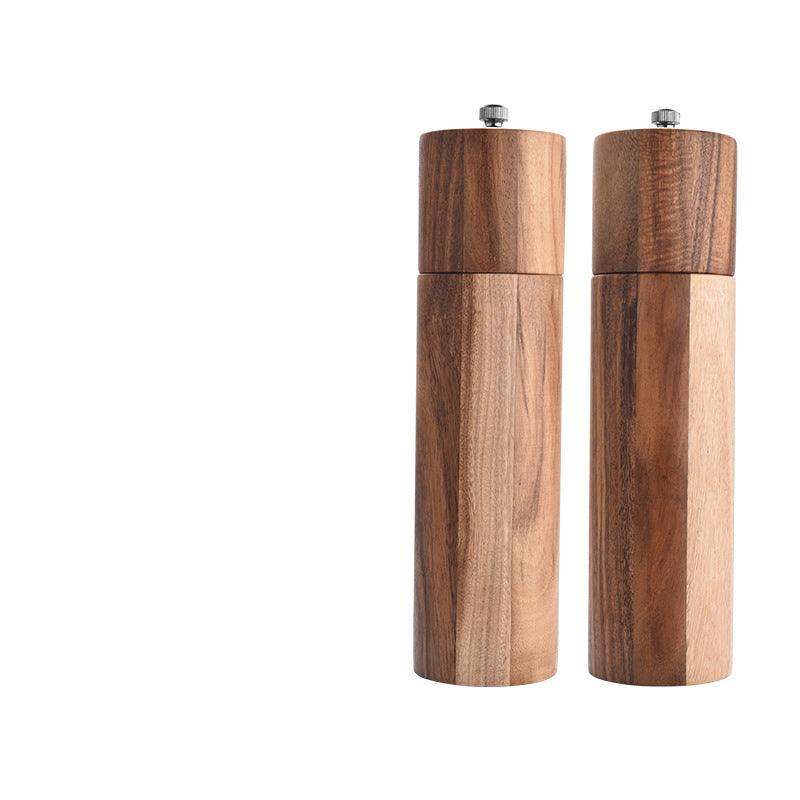 Cylindrical ceramic core pepper grinder with acacia wood finish.