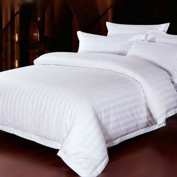 Four-piece hotel bedding set with polyester cotton fabric and reactive dyeing.