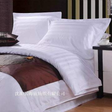 Four-piece hotel bedding set with polyester cotton fabric and reactive printing.