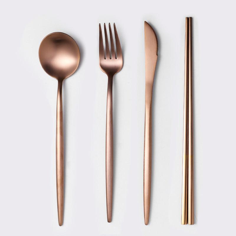 Stainless steel cutlery set with spoon, fork, knife, and chopsticks, mirror polished.