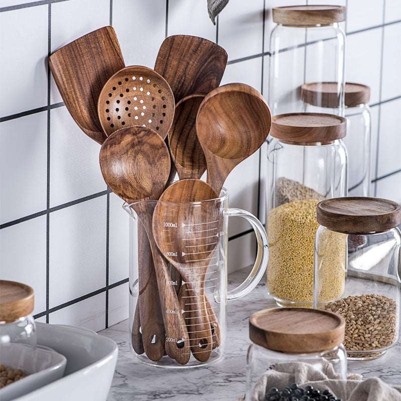 Thailand Teak Natural Wood Tableware Set with Spoons, Ladles, and Skimmers in Kitchen Display.