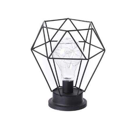 Minimalist hollow table lamp with geometric iron design for home decoration.